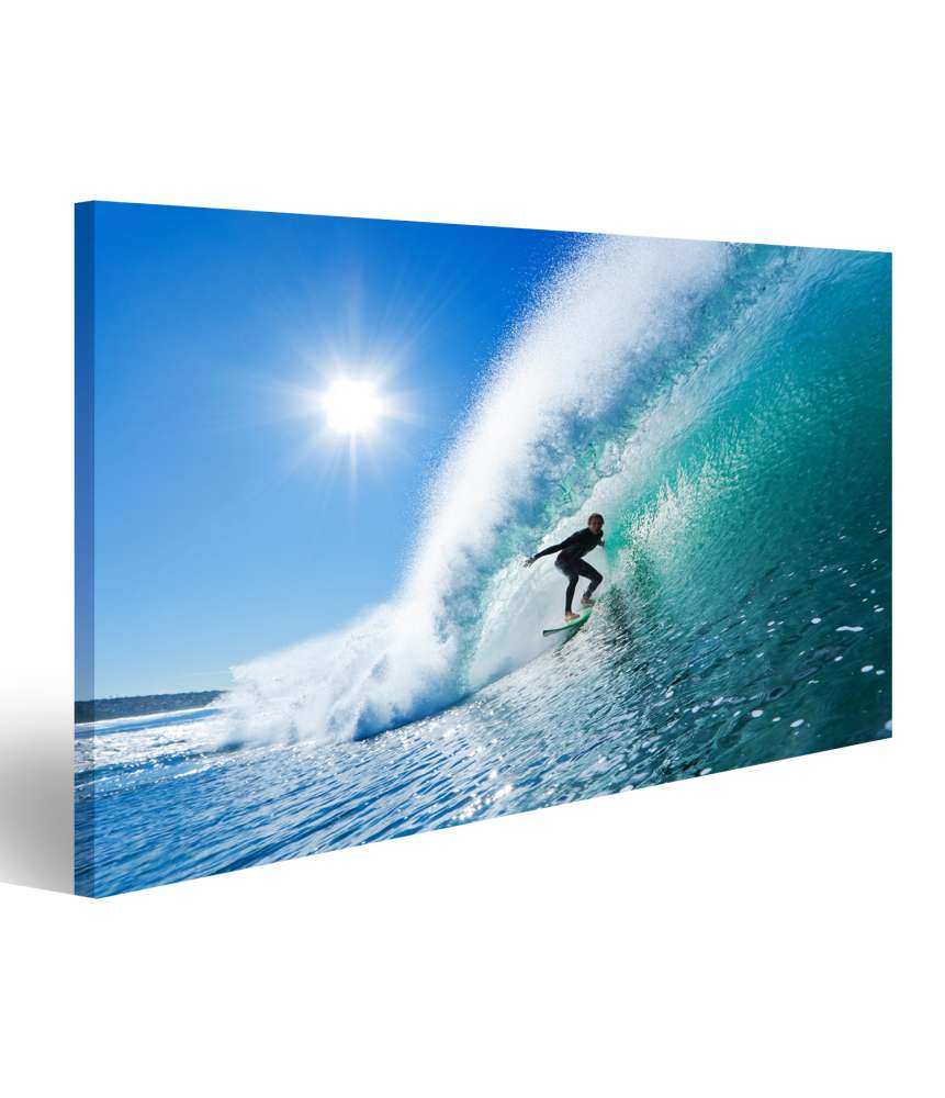 Islandburner Bild auf Leinwand Surfer Riding a Majestic Blue Ocean Wave