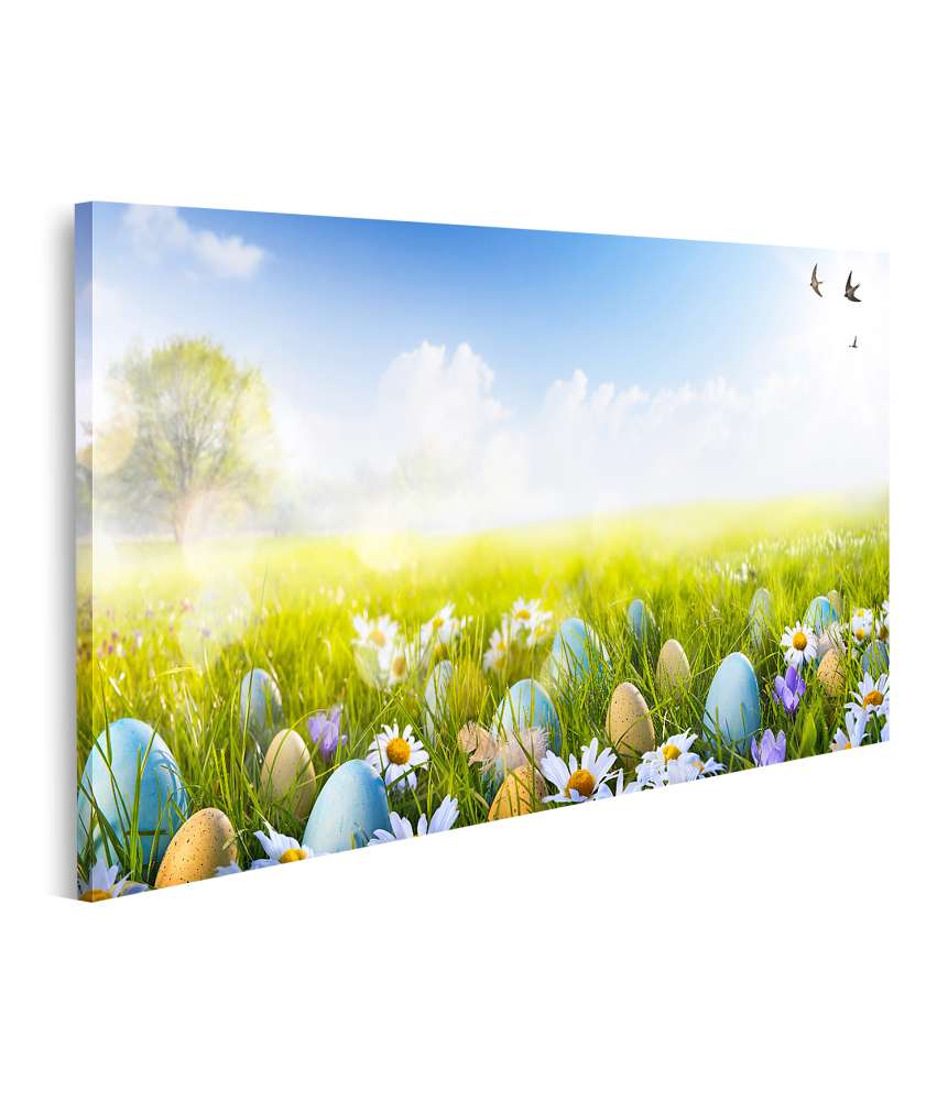 Islandburner Bild auf Leinwand Vibrantes Wandbild von bunt bemalten Ostereiern und Blumen im Gras