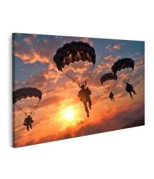 Bild auf Leinwand Fallschirmspringende Militärs landen geschickt mit ihren Fallschirmen