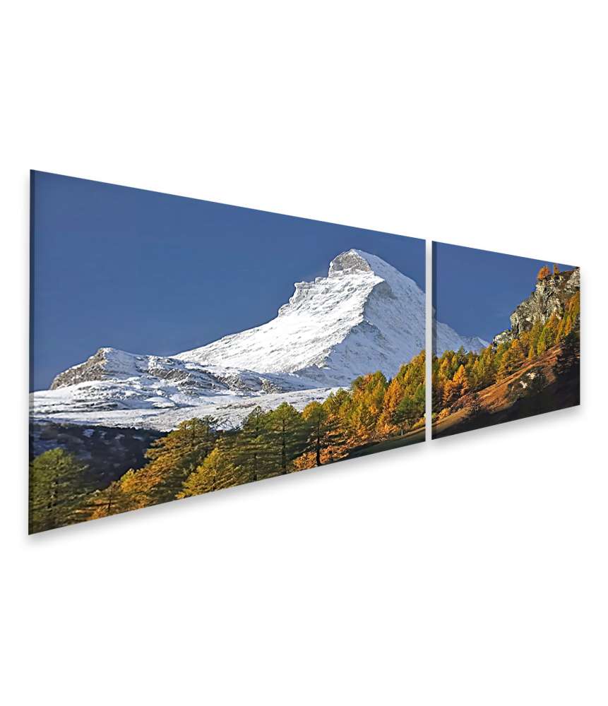 Islandburner Bild auf Leinwand Matterhorn mit Schneedecke, umgeben von Wald unter blauem Himmel