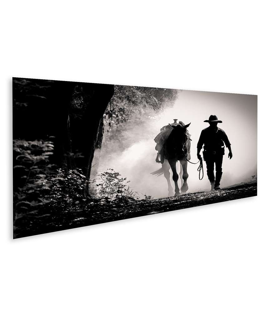 Bild auf Leinwand Schwarz-Weiß-Silhouette eines Cowboys auf einem Pferd beim Sonnenaufgang