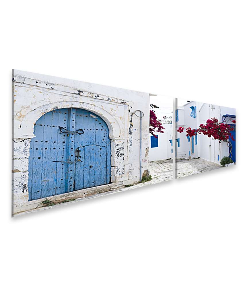 Islandburner Bild auf Leinwand Wandbild von blauen Türen und Fenstern an weißem Gebäude in Sidi Bou Said, Tunesien