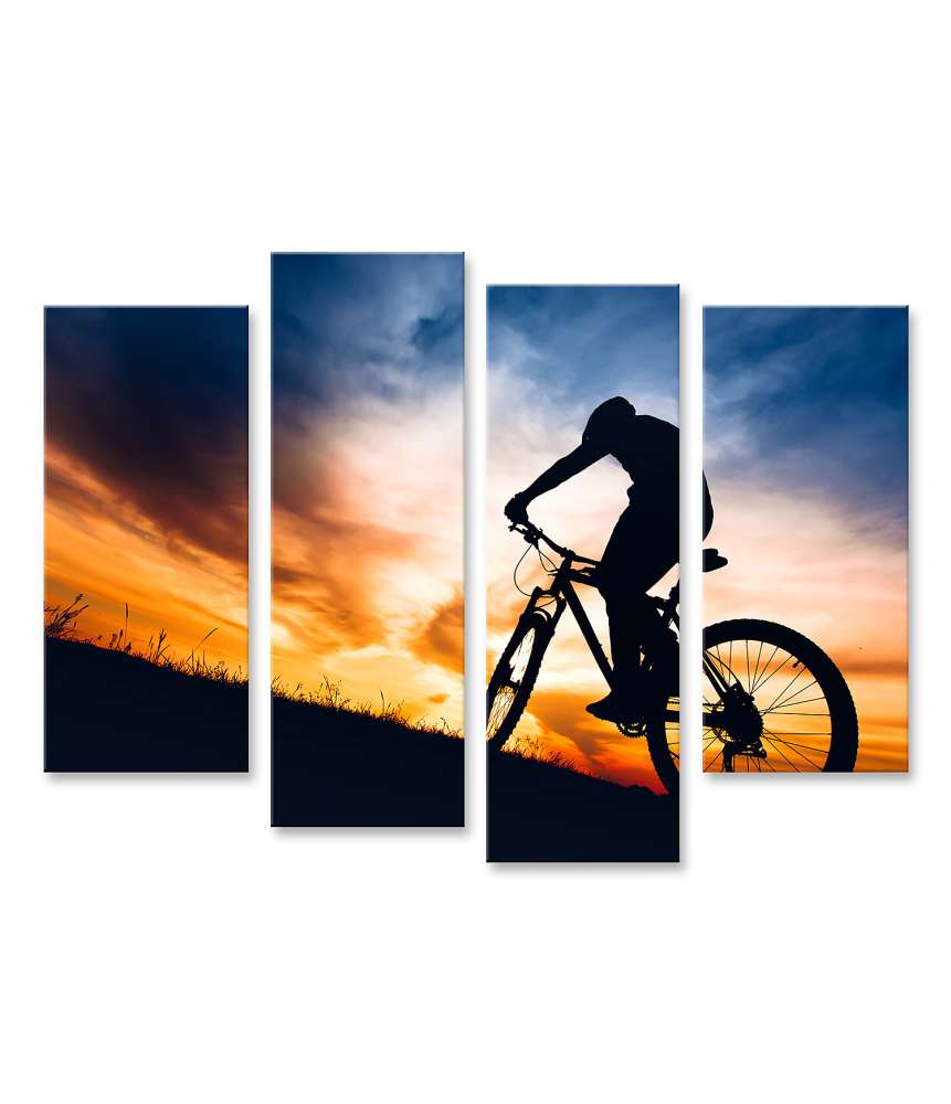 Islandburner Bild auf Leinwand Silhouette eines Sportlers auf Mountainbike beim Sonnenuntergang auf einem Hügel