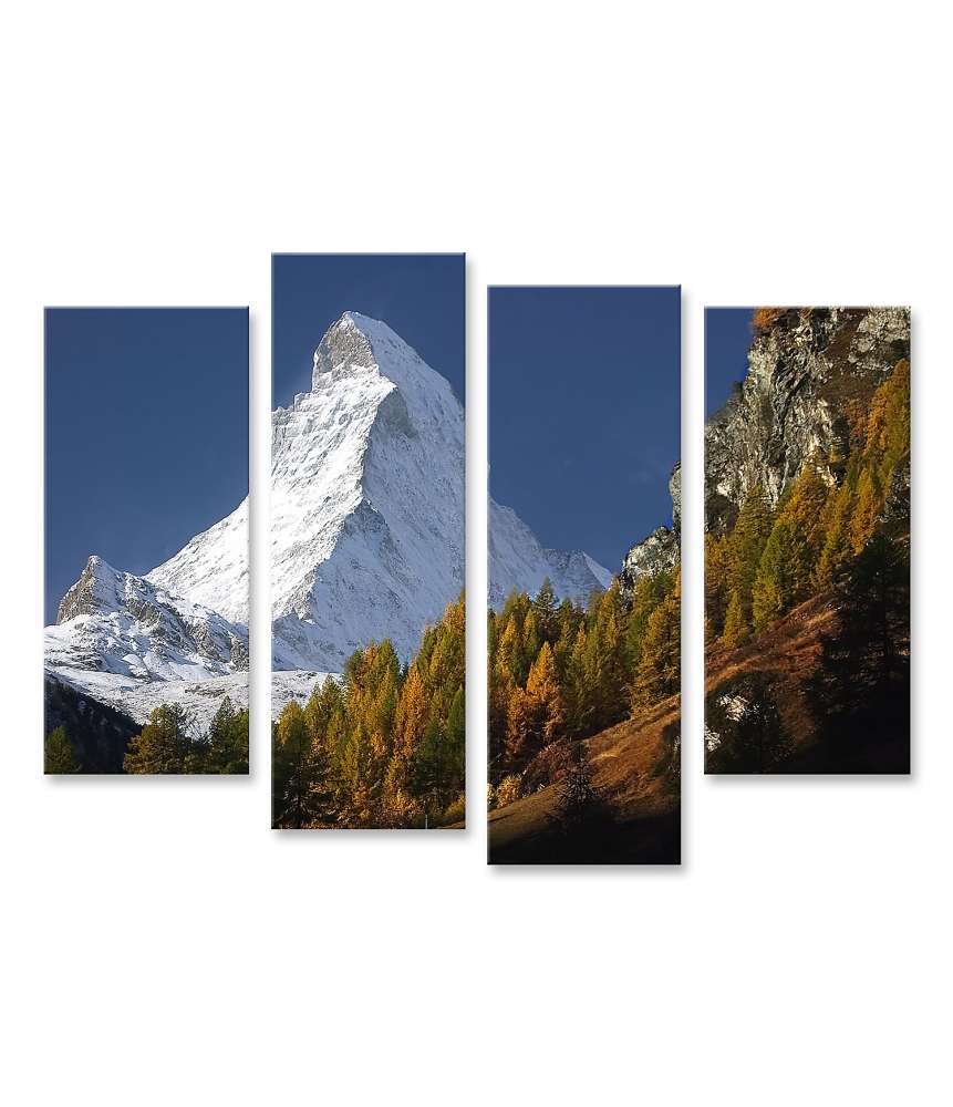 Islandburner Bild auf Leinwand Matterhorn mit Schneedecke, umgeben von Wald unter blauem Himmel