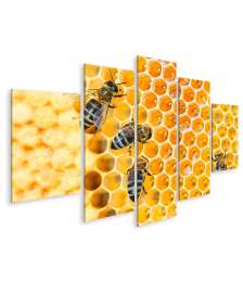 Bild auf Leinwand Fleißige Bienen, die eifrig Honig in ihren Waben herstellen