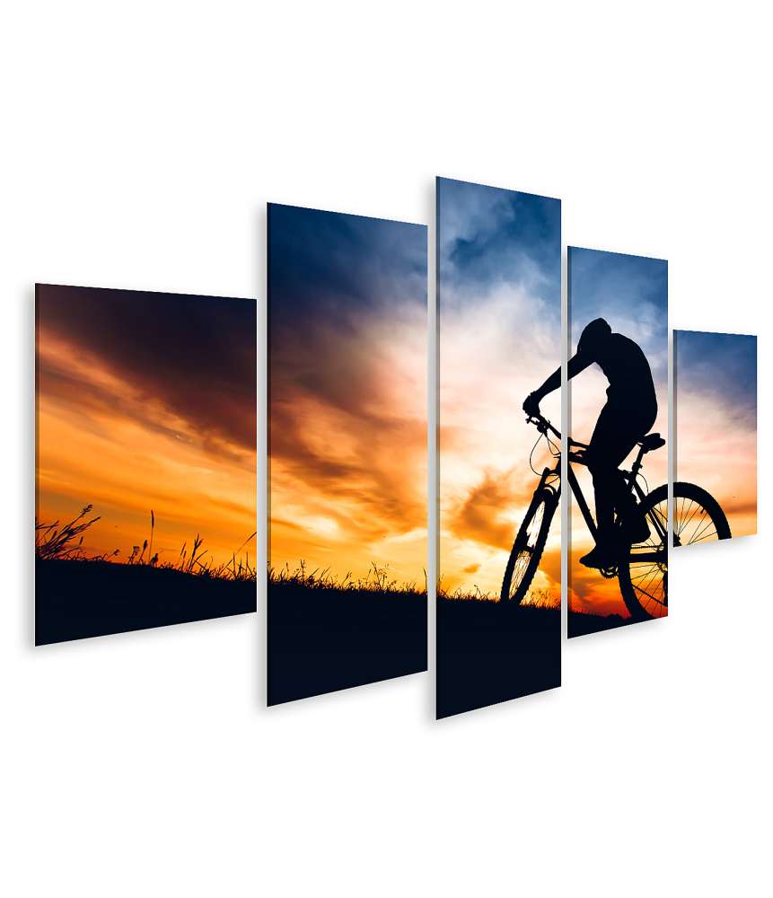 Islandburner Bild auf Leinwand Silhouette eines Sportlers auf Mountainbike beim Sonnenuntergang auf einem Hügel