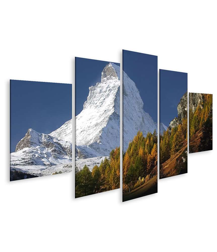 Islandburner Bild auf Leinwand Matterhorn mit Schneedecke, umgeben von Wald unter blauem Himmel